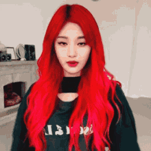 a woman with red hair is wearing a black shirt that says ' i 'm not ' on it