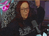 a woman wearing glasses and a sweater that says ' ияс ' on it