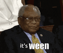 a man in a suit and tie with the words it 's ween above him