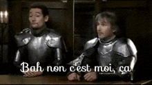 two men in armor are sitting at a table with the words bah non cest moi ca written on the bottom