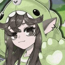 a girl wearing a green frog costume has a piercing in her left ear