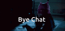 a woman wearing a cat hat says bye chat in the dark