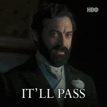 a man in a tuxedo says " it 'll pass " in white letters