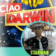 a man wearing a hat and tie stands in front of a sign that says ciao darwin