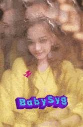 a girl in a yellow sweater is surrounded by other people and the word baby sys is displayed
