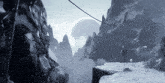 a black and white photo of a snowy mountain landscape with a moon in the background