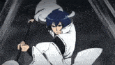 a person with blue hair is holding a stick in their hand .