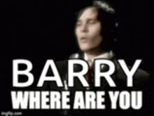 a man in a suit and tie is singing into a microphone with the words barry where are you .