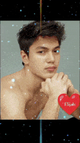 a picture of a shirtless man with a red heart that says elijah on it