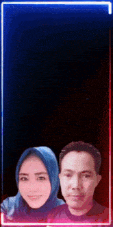 a man and a woman are posing for a picture with a neon frame around them