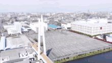 an aerial view of a city with lots of buildings and a large white building that says ' eee ' on it