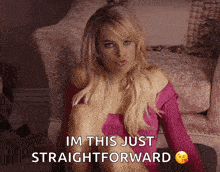 a woman sitting in a chair with the words im this just straightforward