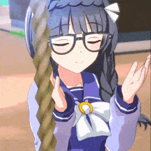 a girl wearing glasses is holding a rope in her hand