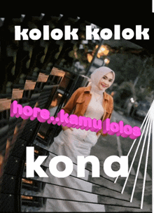 a woman in a hijab stands in front of a fence with the words kolok kolok here kamu lolos kona written below her
