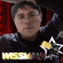 a man wearing glasses and a shirt that says wissman on it