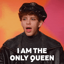 a man wearing a police hat and a leather jacket says i am the only queen