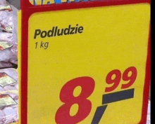 a yellow sign in a store that says podludzie