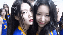 a group of girls are posing for a picture and one of them has a star clip in her hair