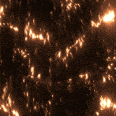 a dark background with a lot of glowing lights