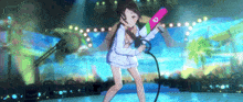 a girl in a white shirt is holding a pink object with a s on it
