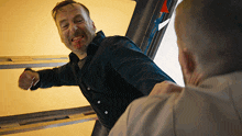 a man with blood on his face is being punched