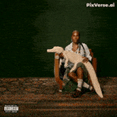 a woman is sitting in a chair playing with a toy alligator with a parental advisory explicit content sticker on it