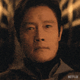 a close up of a man 's face with netflix written on the bottom right