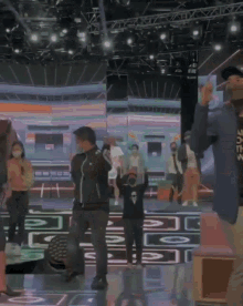 a man wearing a mask is dancing with a woman
