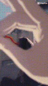 a snake is crawling out of a hole in a wall in a cartoon .