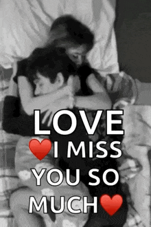 a man and a woman are hugging each other on a bed .