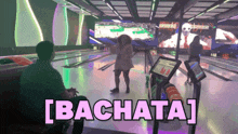 a woman is dancing in a bowling alley and the word bachata is on the screen