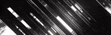 a black and white photo of a building with a diagonal pattern