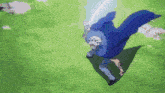 a man in a blue cape is holding a sword in his hand while flying through the air .