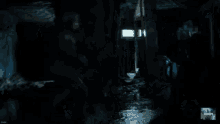 a blurred image of a person in a dark room with the word combat on the bottom left
