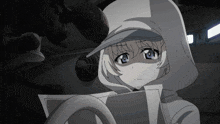 a girl wearing a white hoodie and a blue hat