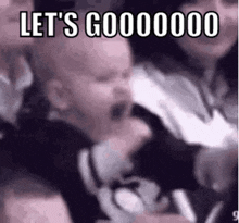 a baby is crying in a crowd of people with the words `` let 's gooooooo '' written on the bottom .