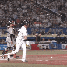a baseball player wearing a helmet with the word mlb on it