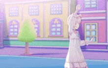 a girl in a white dress stands in front of a colorful building