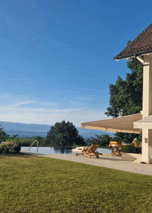 a house with a swimming pool and a view of the mountains
