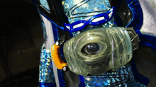 a close up of a clear item with a blue strap on it