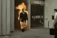 man walk out on fire.