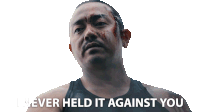 a man with blood on his face has the words " i never held it against you " above him