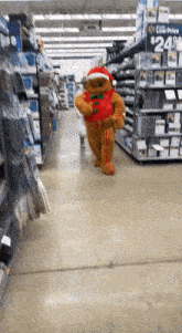 a person in a gingerbread man costume is walking through a store