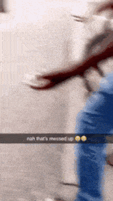 a blurry picture of a person walking down a street with a caption that says nah that 's messed up