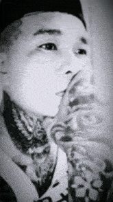 a black and white drawing of a man with a tattoo on his arm