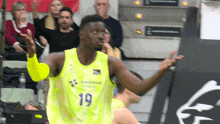 a basketball player with the number 19 on his shirt
