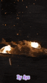 a picture of an explosion with the words by ays on the bottom right