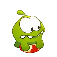 a green cartoon character is sitting on a red and white ball