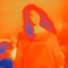 a woman 's face is shown in a colorful image