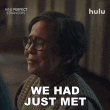 a woman with glasses says " we had just met " in an advertisement for nine perfect strangers